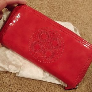 * Coach Perforated C Wallet Patent